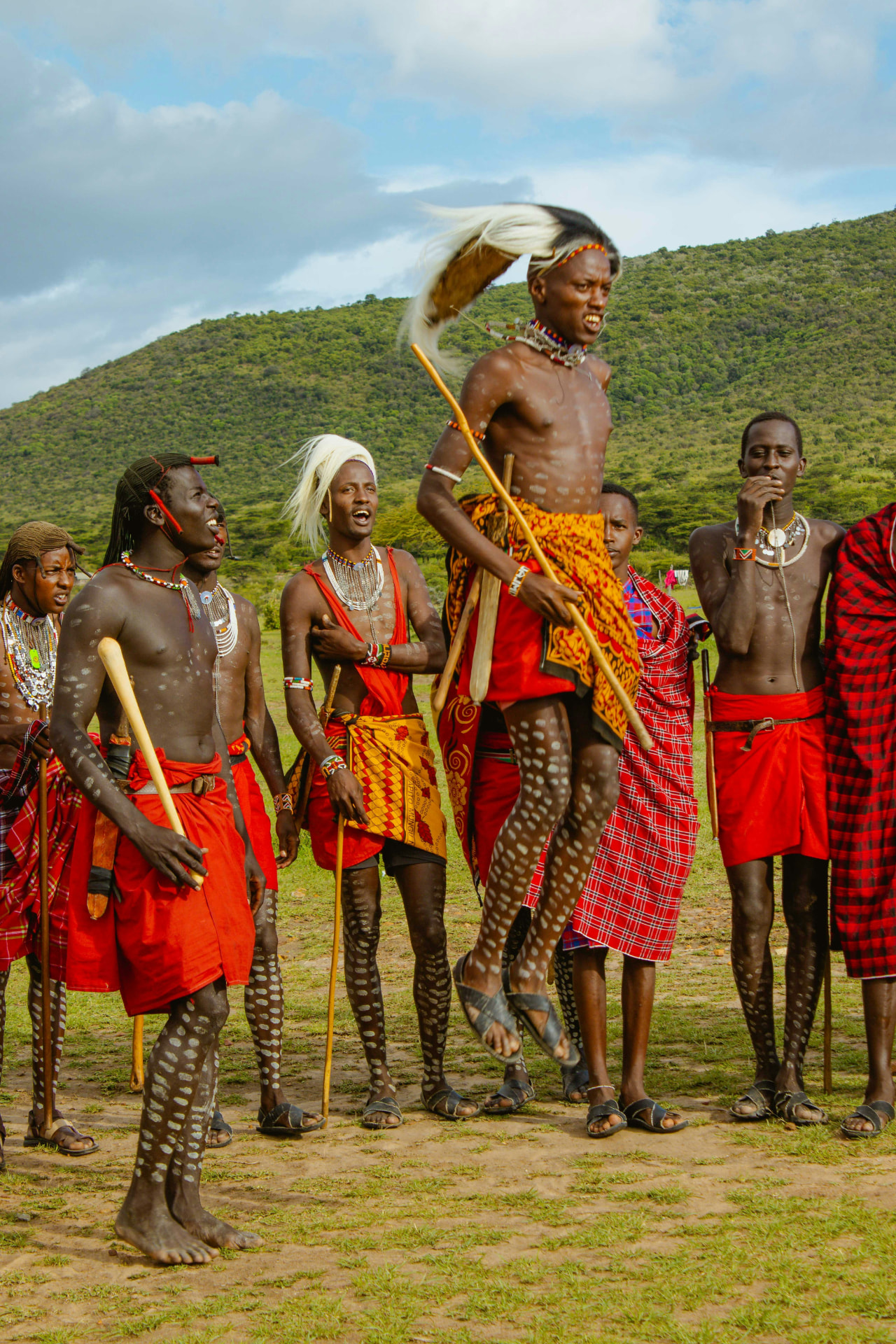 Maasai warriors in traditional dress performing a ceremonial jump in northern Tanzania