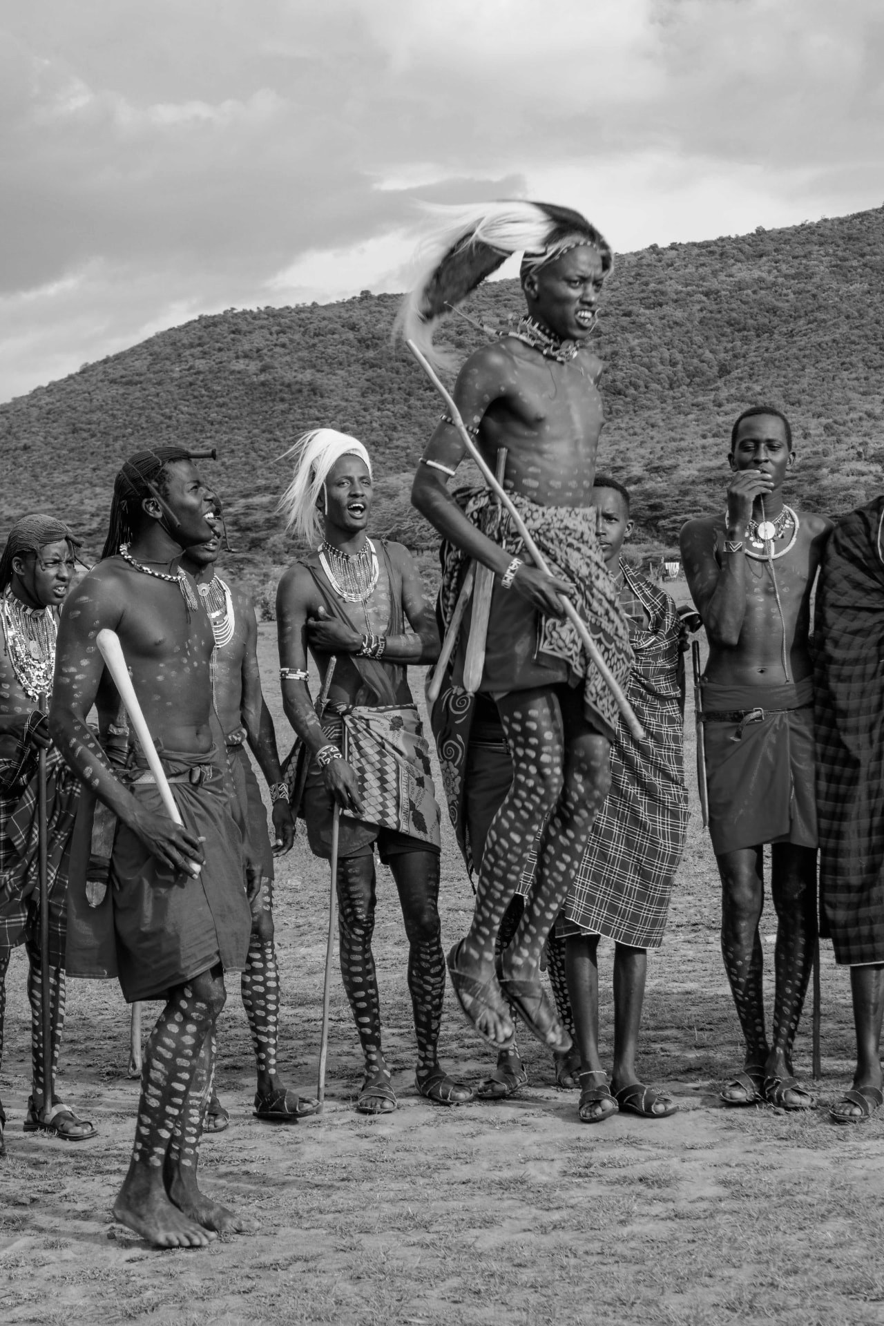 Maasai warriors in traditional dress performing a ceremonial dance in northern Tanzania