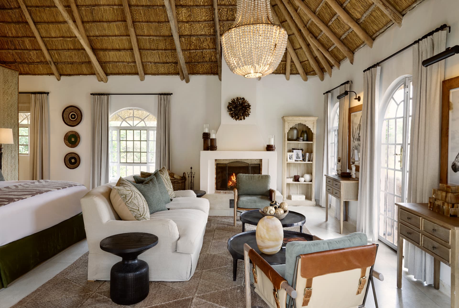 Laba Mama Simba Garden Cottage interior, thatched roof, chandelier, fireplace and garden light