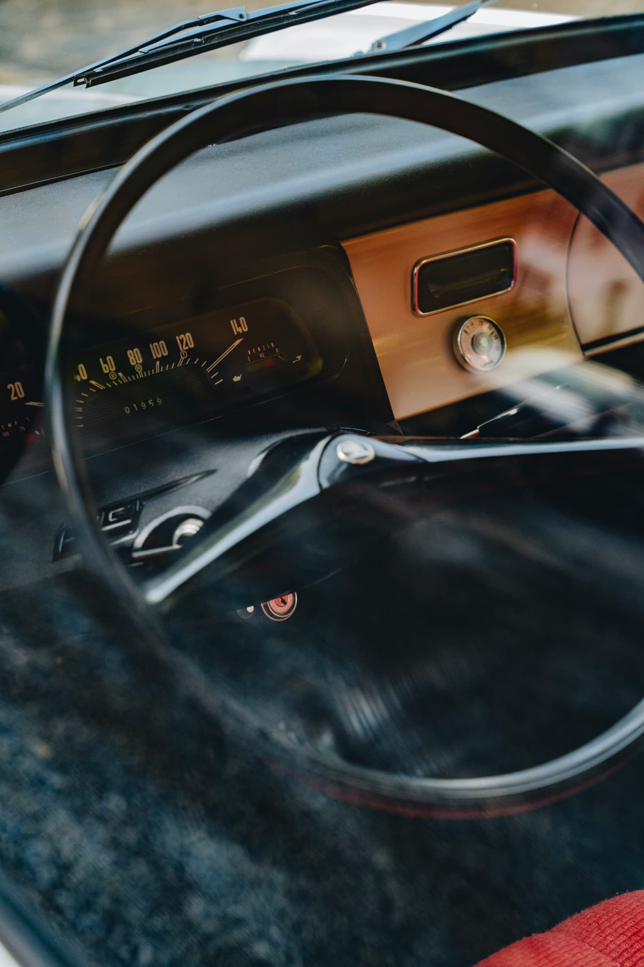 Interior detail of a classic safari vehicle steering wheel and dashboard
