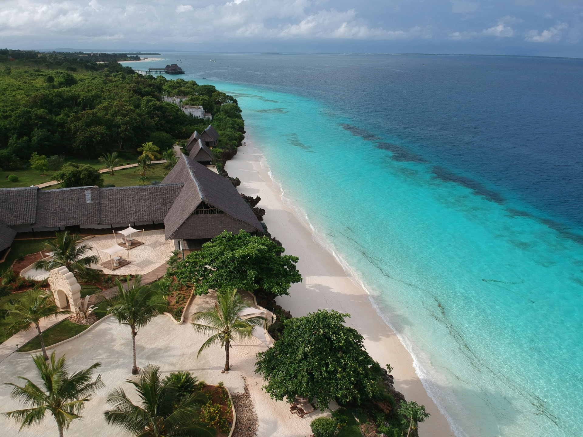 Aerial view of a Zanzibar beach resort with white sand and turquoise water